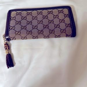 Gucci GG Monogram canvas wallet. Very Good pre-owned condition.